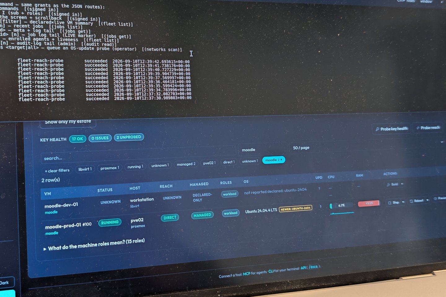 A laptop screen showing a console session: a list of commands and a run of jobs marked succeeded.